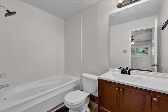 full bathroom featuring vanity, washtub / shower combination, ceiling fan, toilet, and a textured ceiling