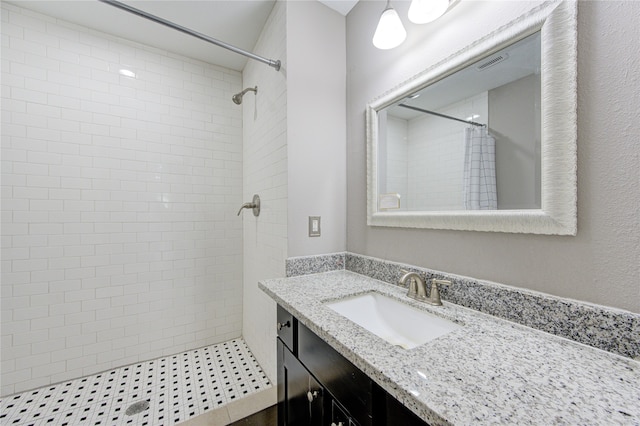 bathroom featuring a shower with curtain and vanity