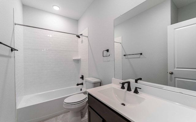 full bathroom featuring vanity, toilet, and tiled shower / bath combo