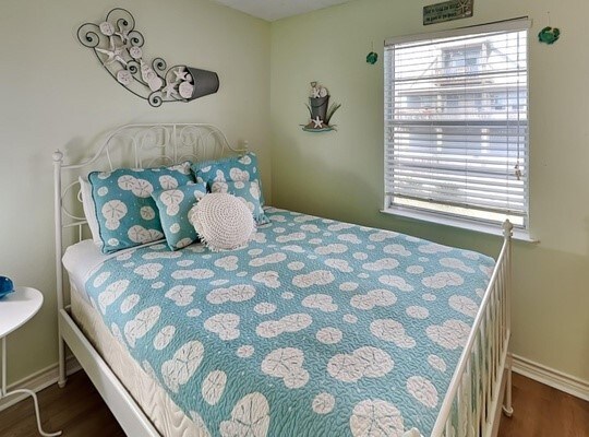 bedroom featuring dark hardwood / wood-style flooring