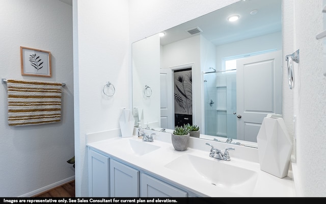 bathroom featuring vanity and wood-type flooring