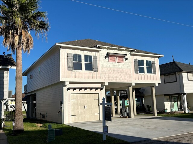 view of front of home with a carport and a garage