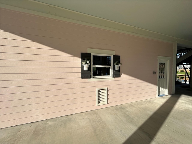 view of property exterior featuring a patio area