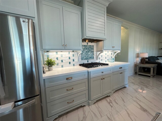 kitchen featuring decorative backsplash and appliances with stainless steel finishes