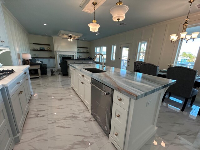 874 Bonita, Bayou Vista, TX 77563 - kitchen featuring stainless steel appliances, light marble finish floors, a sink, open floor plan, and a fireplace