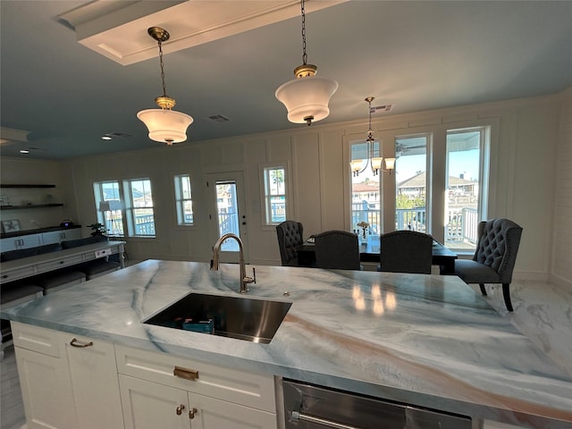 874 Bonita, Bayou Vista, TX 77563 - kitchen with a sink, open floor plan, pendant lighting, and white cabinetry