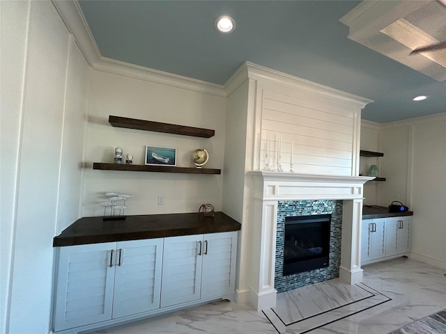 874 Bonita, Bayou Vista, TX 77563 - unfurnished living room featuring light marble finish flooring, a fireplace, recessed lighting, and ornamental molding