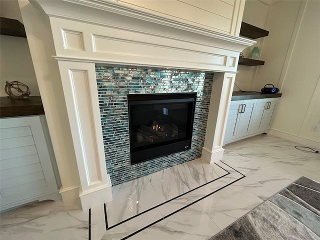 room details featuring a tiled fireplace