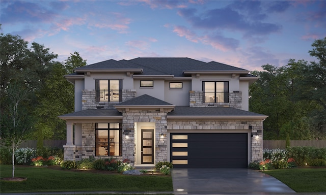 view of front of home featuring a yard and a garage