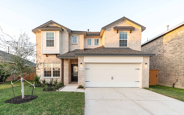 view of front of house with a front lawn and a garage