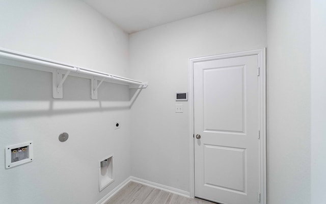 laundry room featuring hookup for an electric dryer, washer hookup, and light hardwood / wood-style flooring