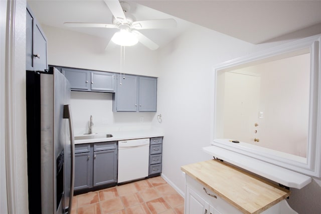 kitchen featuring white dishwasher, sink, ceiling fan, gray cabinets, and stainless steel fridge with ice dispenser