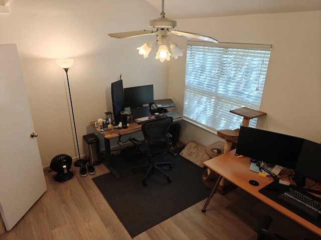 office space with ceiling fan, lofted ceiling, and light wood-type flooring