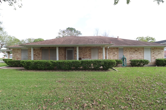 ranch-style house with a front lawn