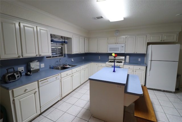 kitchen featuring white appliances, white cabinets, sink, crown molding, and a kitchen island