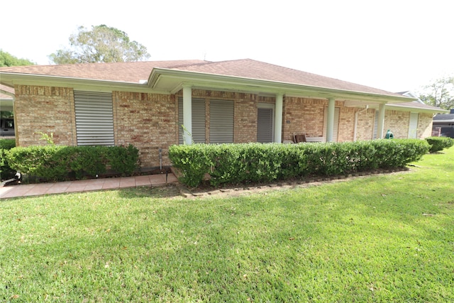 view of property exterior featuring a lawn