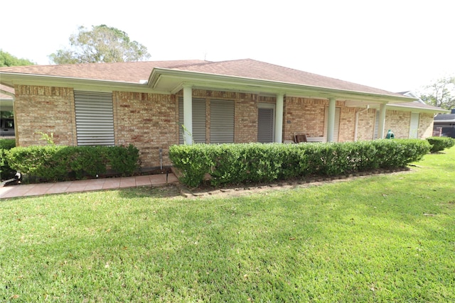 102 N Noble Rd, Texas City, TX 77591 - view of side of home featuring brick siding and a lawn