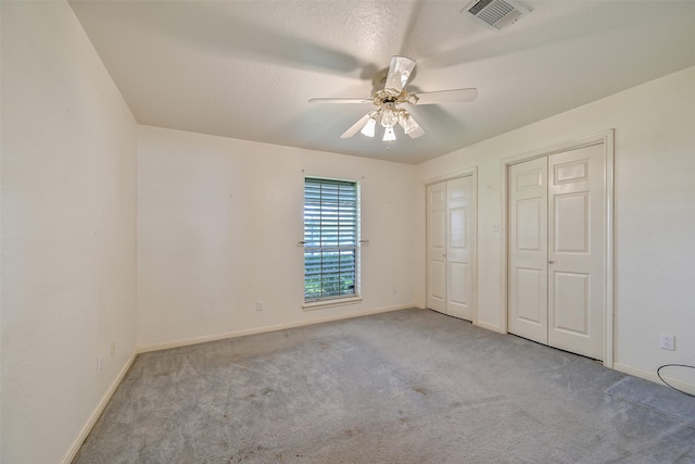 102 N Noble Rd, Texas City, TX 77591 - unfurnished bedroom featuring carpet flooring, multiple closets, baseboards, and a ceiling fan