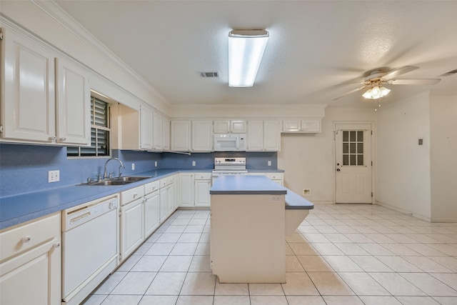 102 N Noble Rd, Texas City, TX 77591 - kitchen featuring white appliances, a sink, a center island, white cabinetry, and ornamental molding
