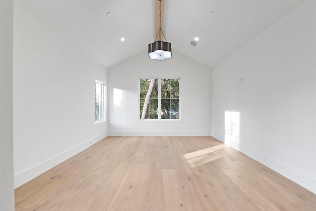 interior space featuring light hardwood / wood-style floors and vaulted ceiling