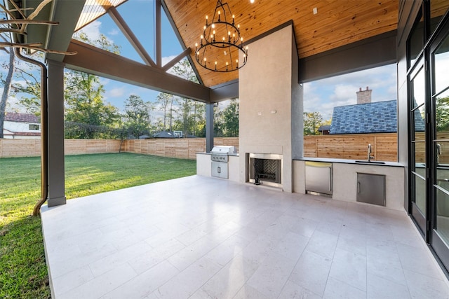 view of patio / terrace featuring an outdoor kitchen, a grill, and sink