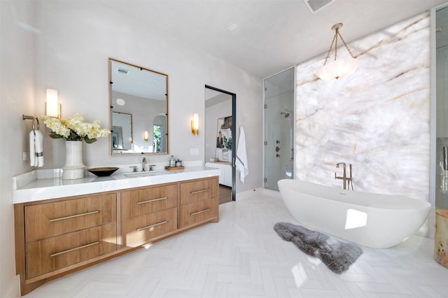 bathroom featuring separate shower and tub and vanity