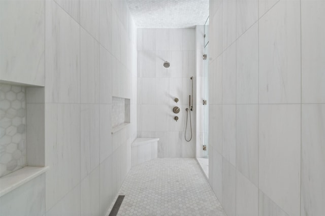 bathroom featuring a tile shower