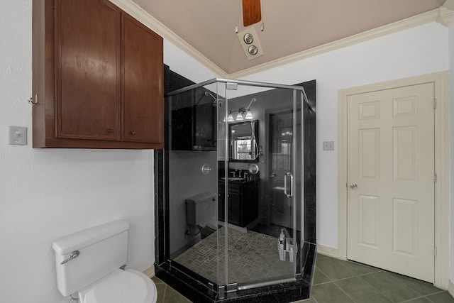 bathroom featuring tile patterned flooring, toilet, walk in shower, and crown molding