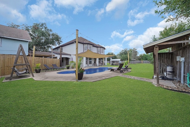 exterior space with a patio area and a yard