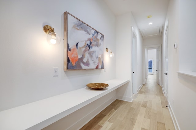 hallway with light hardwood / wood-style floors