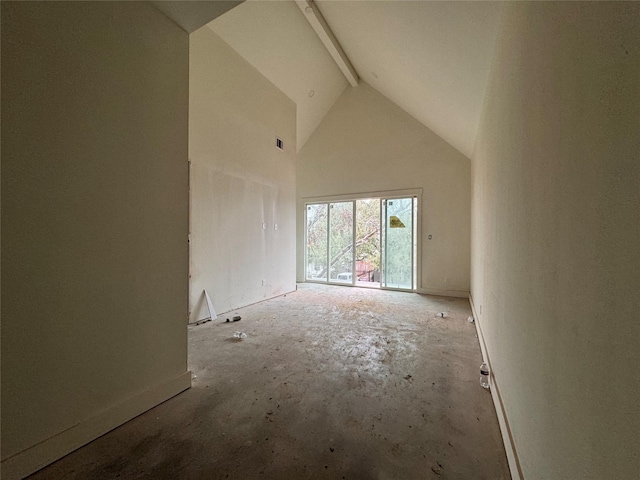 unfurnished room featuring beamed ceiling and high vaulted ceiling