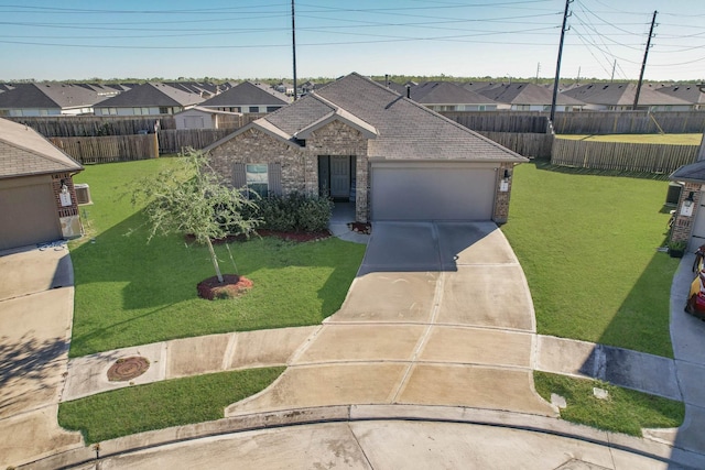 view of front of property with a front lawn and a garage