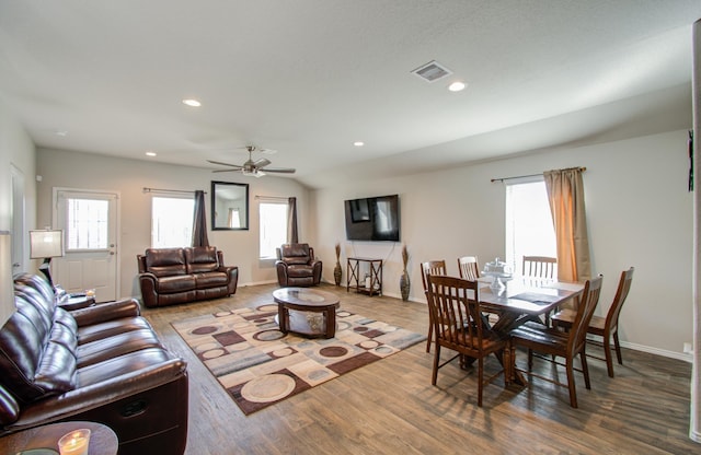 dining space with ceiling fan and hardwood / wood-style floors