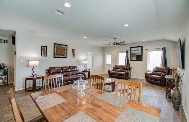 dining space featuring wood-type flooring, ceiling fan, and lofted ceiling