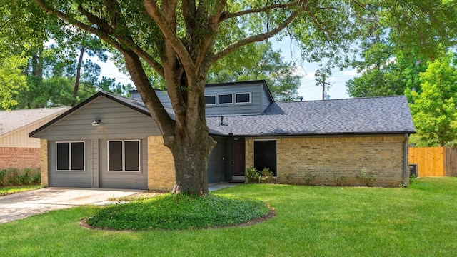 1611 Cantrell Blvd, Conroe, TX 77301 - mid-century modern home featuring brick siding and roof with shingles