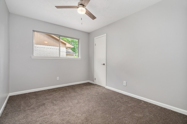 empty room featuring ceiling fan and carpet floors