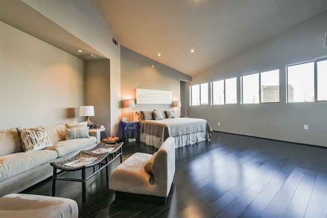 bedroom with lofted ceiling and dark wood-type flooring