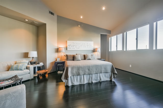 bedroom featuring dark hardwood / wood-style floors and lofted ceiling