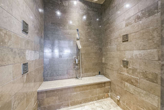 bathroom featuring a tile shower