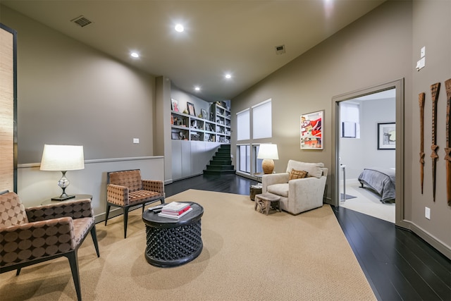 sitting room with wood-type flooring