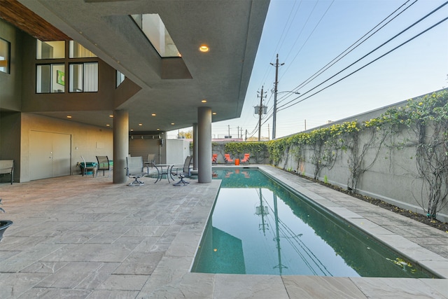 view of swimming pool featuring a patio area