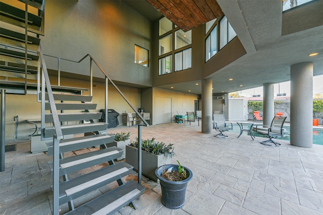 view of patio / terrace with an indoor pool