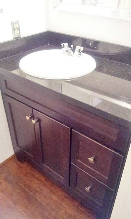 bathroom with wood-type flooring and vanity