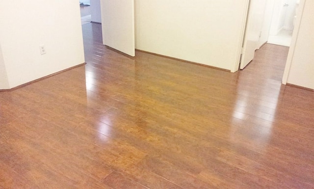 unfurnished room featuring hardwood / wood-style flooring