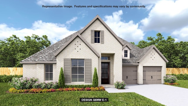 view of front of house featuring a front yard and a garage