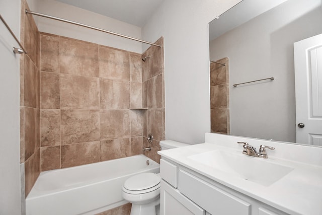 full bathroom with vanity, toilet, and tiled shower / bath