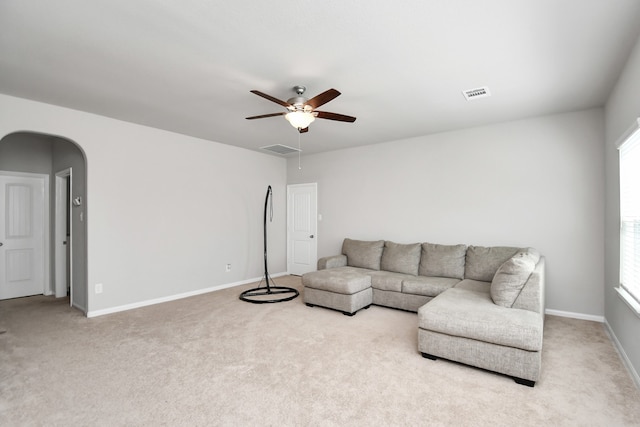 living room with carpet flooring and ceiling fan