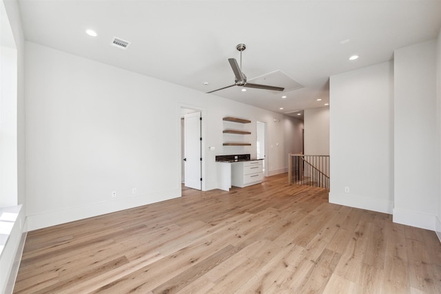 unfurnished living room with ceiling fan and light hardwood / wood-style floors