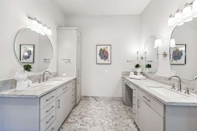 bathroom with tile patterned flooring and vanity