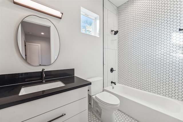 full bathroom with tile patterned floors, vanity, toilet, and tiled shower / bath